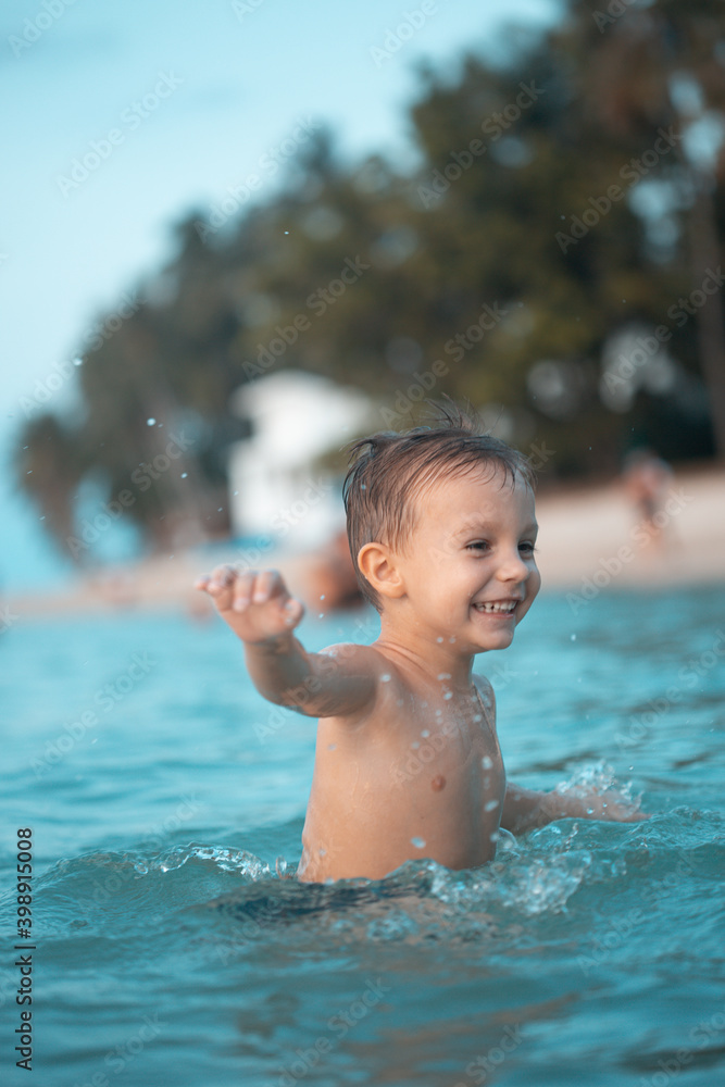 Happy boy have fun at sea