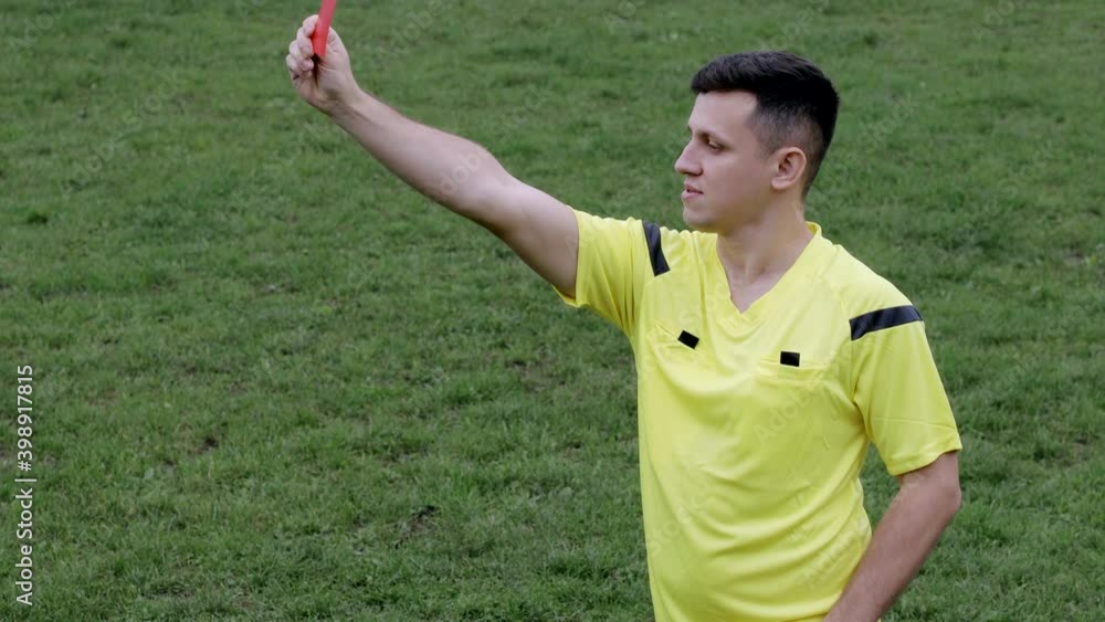 Referee showing a yellow, red cards and removing player while gaming. Concept of sport, rules violation, controversial issues, obstacles overcoming. Referee showing a yellow, red cards and removing player while gaming. Concept of sport, rules violation, controversial issues, obstacles overcoming.