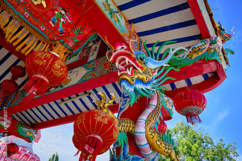 dragon and lanterns in a Chinese temple during a sunny day 