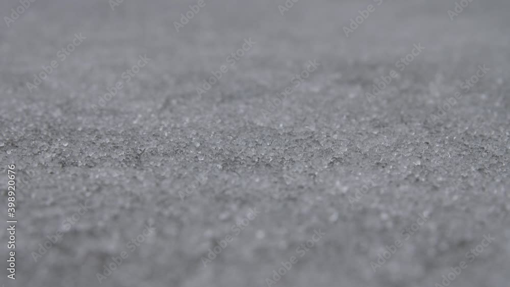 The road surface is covered with hail. The process of falling pieces of ice. The road surface is covered with hail. The process of falling pieces of ice.