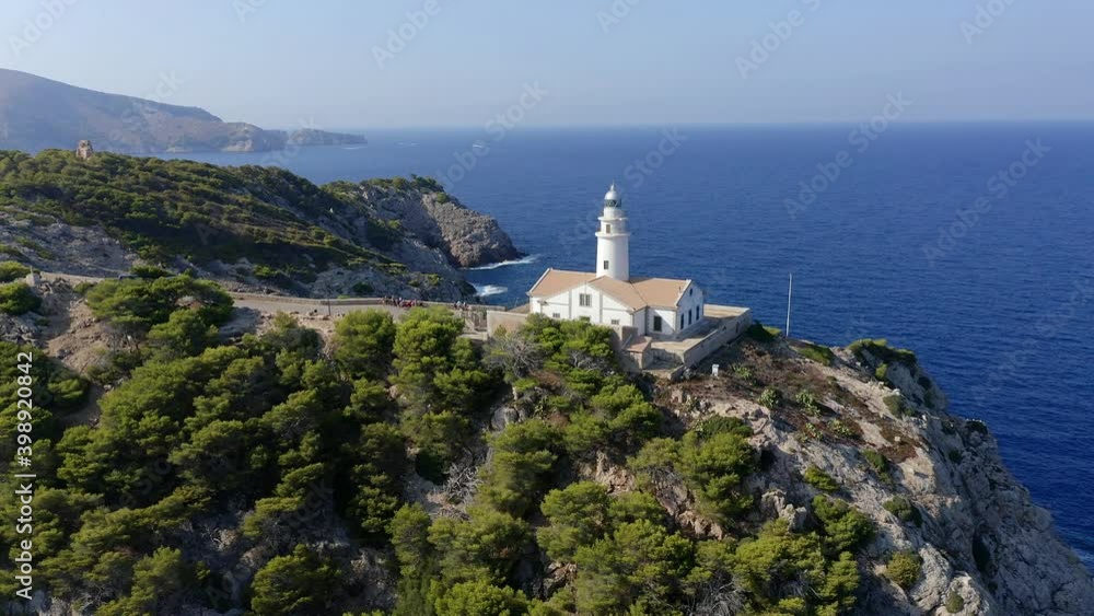 Aerial view, flight at lighthouse Far de Capdepera with cliffs, Cala Ratjada, Mallorca, Balearic Islands, Spain Aerial view, flight at lighthouse Far de Capdepera with cliffs, Cala Ratjada, Mallorca, Balearic Islands, Spain
