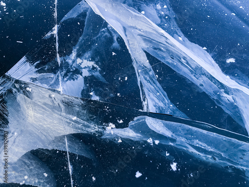 Pattern of crack in ice. Frozen water textured background