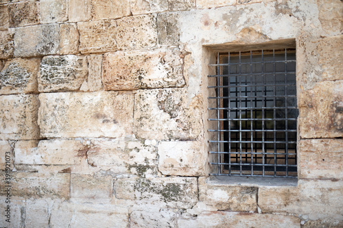 Lattice on the window of a fortress from the era of the Roman Empire