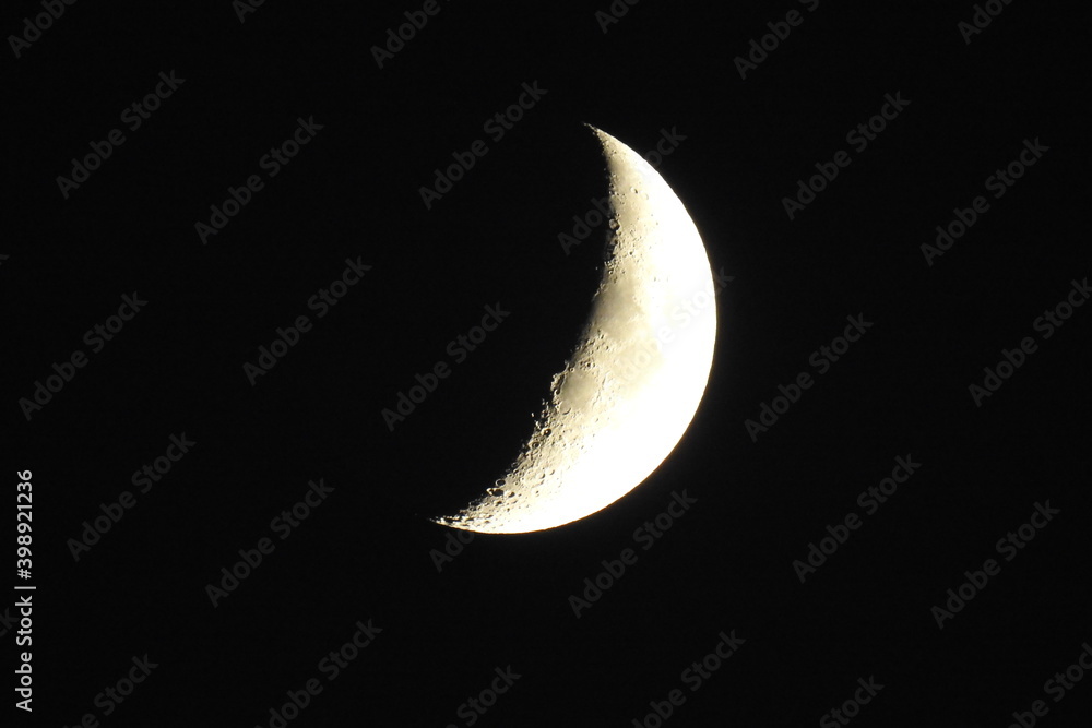 Waxing crescent moon above the Sierra Nevada Mountains, California, on a dark autumn night. Waxing crescent moon above the Sierra Nevada Mountains, California, on a dark autumn night.