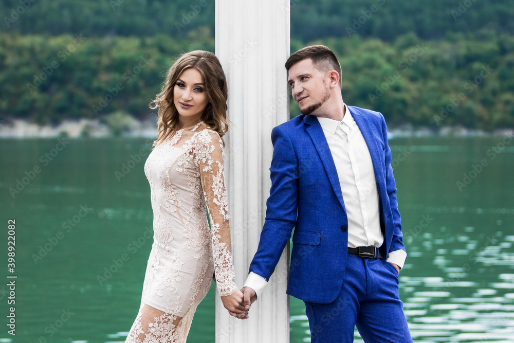 Fototapeta premium Beautiful young couple. Wedding. A family