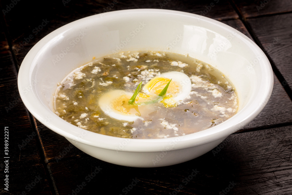 vegetable sorrel soup with egg in a plate vegetable sorrel soup with egg in a plate