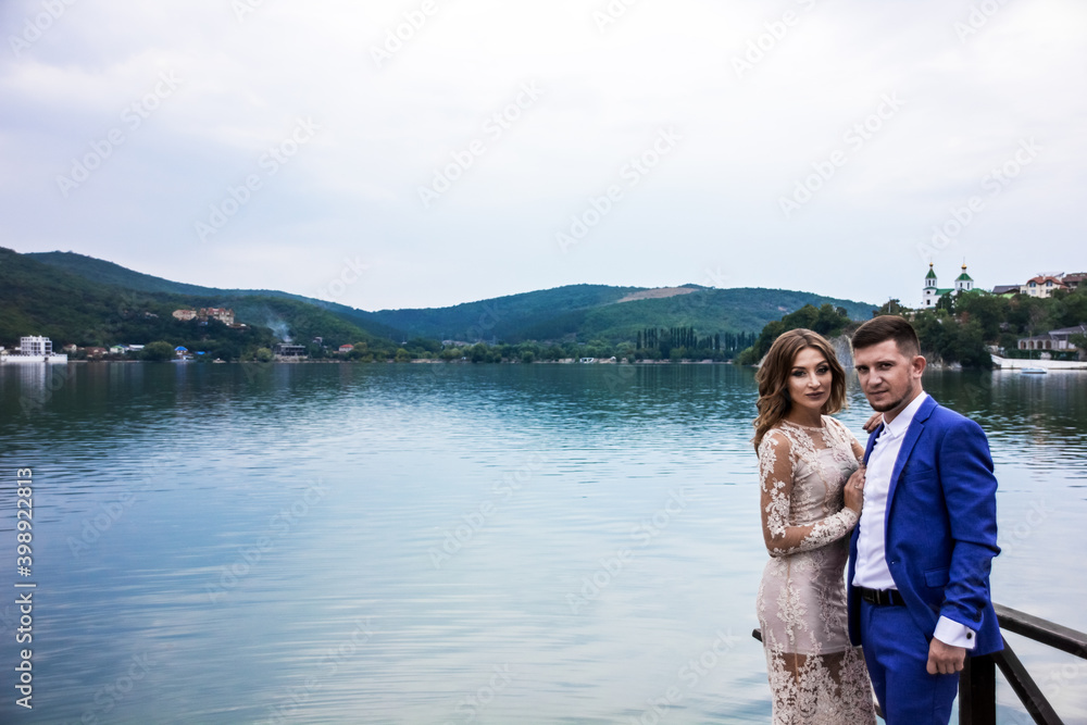 Fototapeta premium Beautiful young couple. Wedding. A family