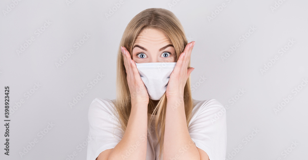 Embarrassed Young caucasian woman wearing medical mask standing over isolated white background, with shocked expression. Embarrassed Young caucasian woman wearing medical mask standing over isolated white background, with shocked expression.