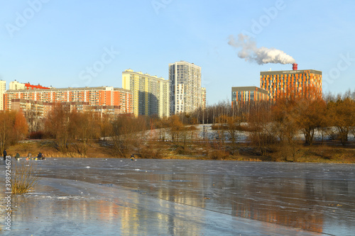Mitino area from side of frozen Lake Penyagino in landscape park. Moscow, Russia © valeriyap