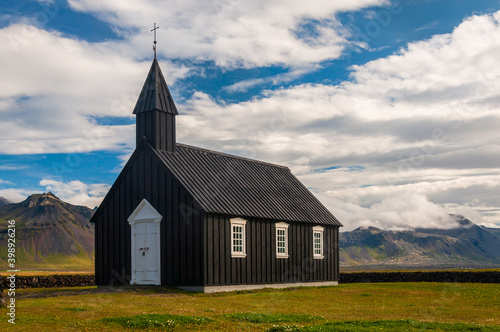 Black church of Budir (Búðakirkja in icelandic) is located on the southern side of the Snaefellsness peninsula in Iceland. Picture taken in summer in a rare sunny day