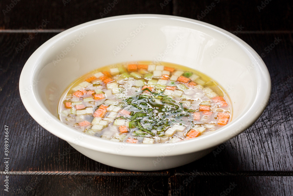 vegetable soup with carrots and zucchini garnished with dill vegetable soup with carrots and zucchini garnished with dill