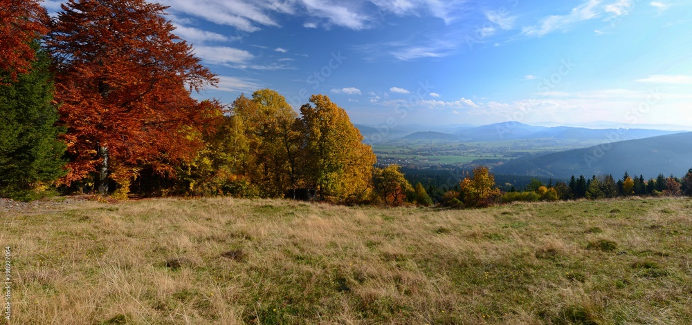 Autumn in Beskydy mountains, Czech republic. Colorful trees, valley view, panorama.