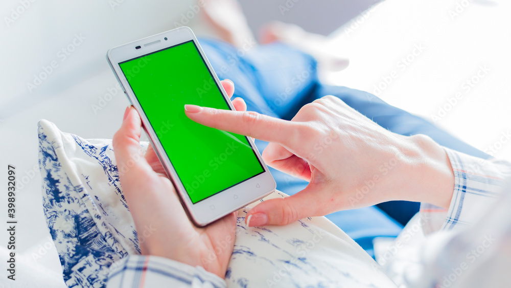woman is relaxing on comfortable couch and using smartphone at home woman is relaxing on comfortable couch and using smartphone at home