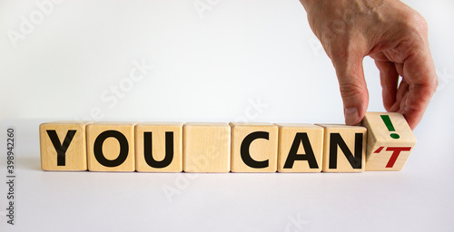 Wallpaper Mural You can symbol. Hand turns a cube and changes the words 'you can't' to 'you can'. Beautiful white background. Concept of business vision and determination. Copy space. Torontodigital.ca
