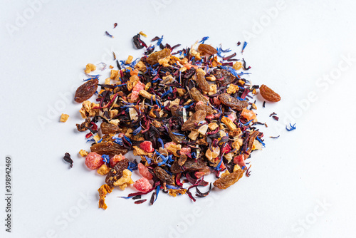 black tea with fruits and petals photo