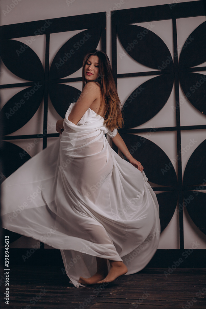 Fototapeta premium Beautiful pregnant girl in white dress
