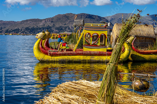 Peru, Lake Titicaca, traditional reef boats with local people. photo