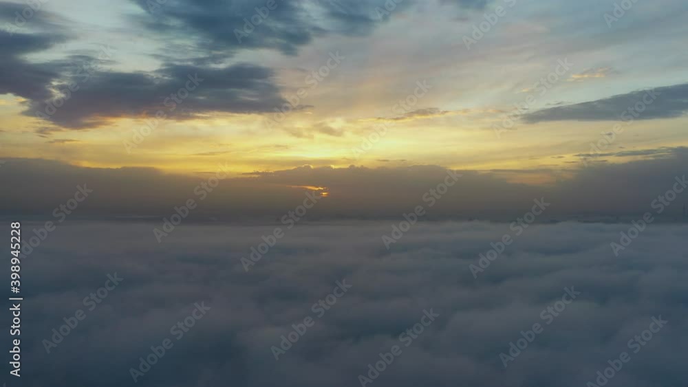 Flight over the clouds at dawn with immersion in the fog. Flight over the clouds at dawn with immersion in the fog.