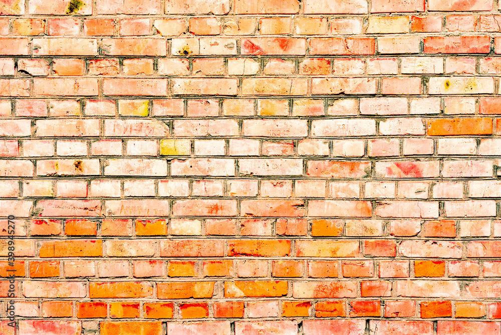 Obraz premium Texture of a brick wall with cracks and scratches which can be used as a background