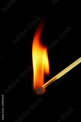 Burning match on a black background