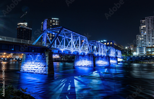 Grand Rapids, Michigan  USA - October 9 -2020: Blue Bridge of downtown Grand Rapids glows vibrant after dark