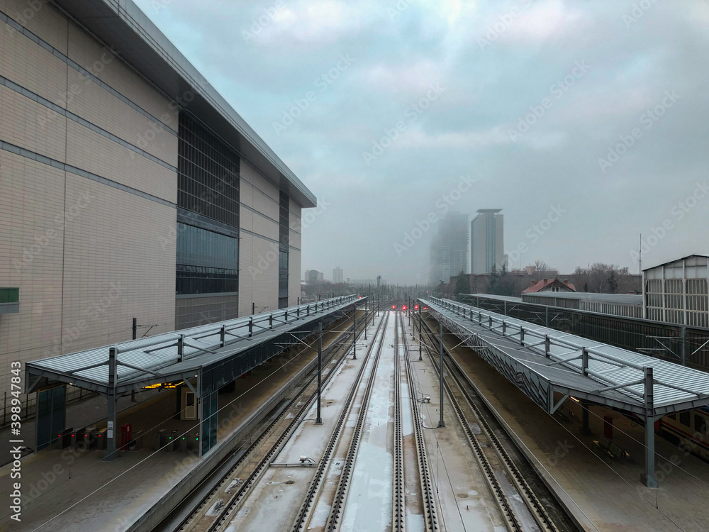 Train station and rails in the winter season. Train station and rails in the winter season.