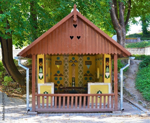 Colorful wooden aresanal house in a European park