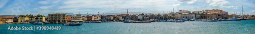 A wide panorama view of the inner harbour of Chania, Crete on a bright sunny day
