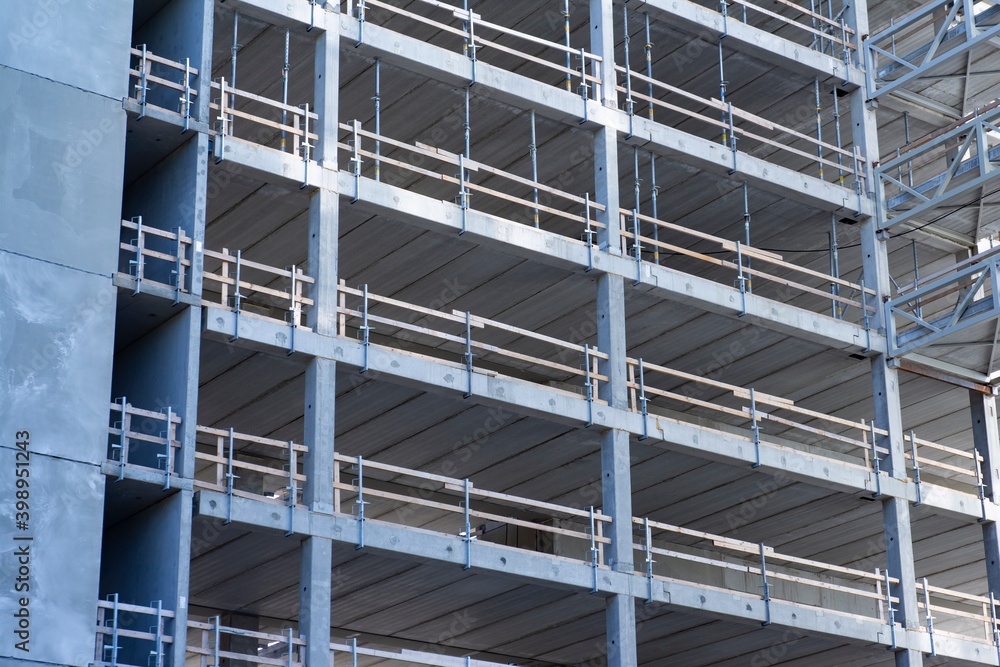Fragment background of a skyscraper contruction with several concrete floors without floors and windows Fragment background of a skyscraper contruction with several concrete floors without floors and windows