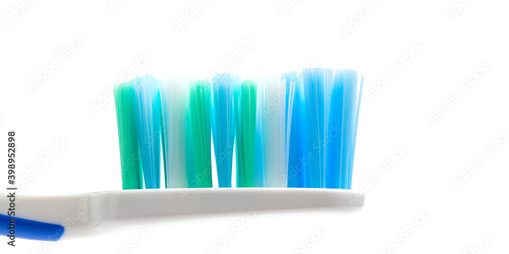 Toothbrush head close-up view, isolated on white background, macro Toothbrush head close-up view, isolated on white background, macro