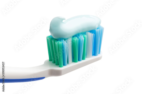 Toothbrush head with toothpaste  close-up view  isolated on white background  macro