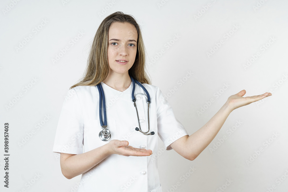 Medicine and health concept. Doctor pointing with his hands to the side. Medicine and health concept. Doctor pointing with his hands to the side.
