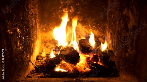 slowly burning fire in the fireplace of the Russian house
