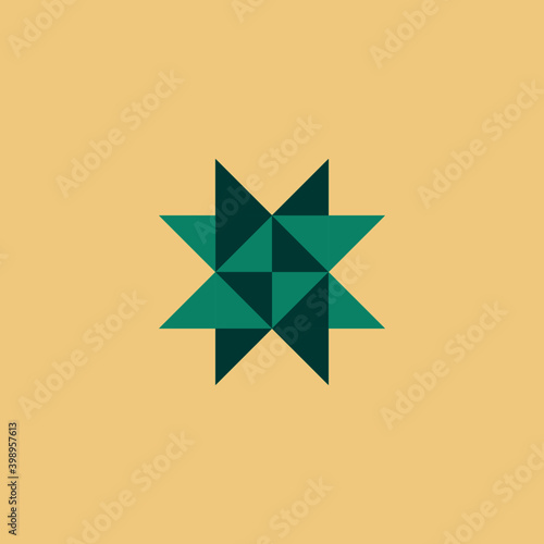 Froebel star in mint and dark green on cream background.