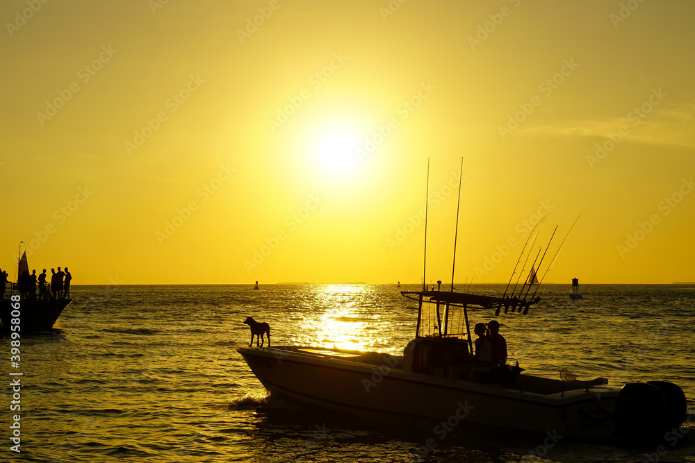 Key West sunset with dog on deck of boat