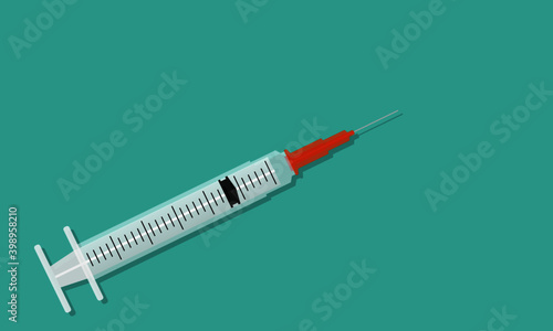 Medical syringe on light blue background
