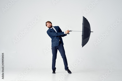 man with open mouth classic suit model in full growth on a light background