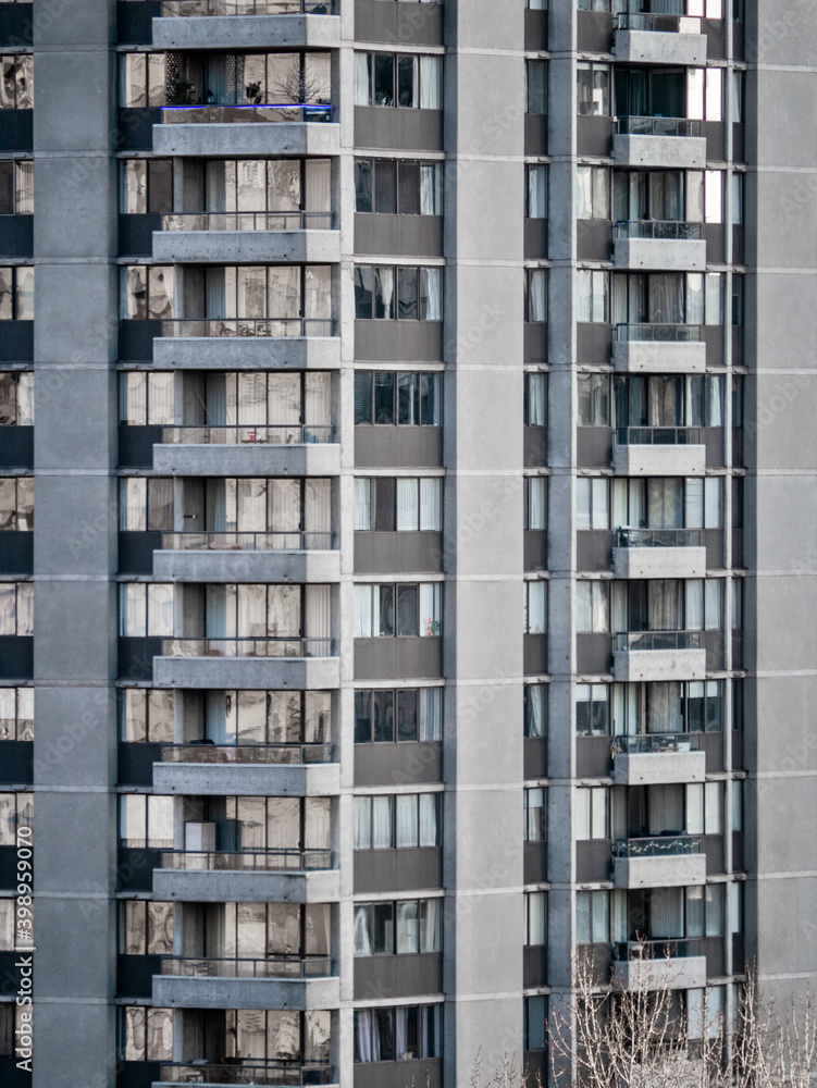 Facade of residential high-rise towers on bright sunny day Facade of residential high-rise towers on bright sunny day