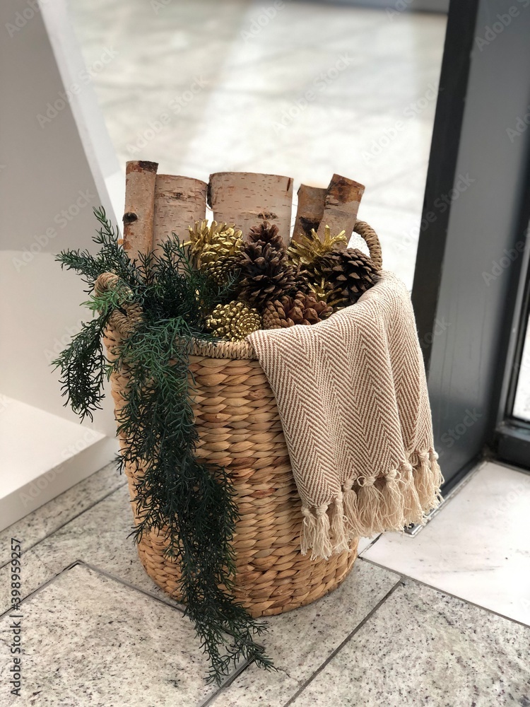 Firewood basket for fireplace. Cozy atmosphere at home before Christmas.  Stock Photo | Adobe Stock