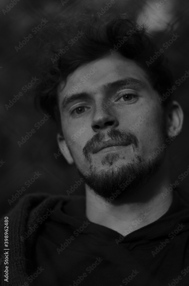 
black and white portrait of a guy with usmi and a beard