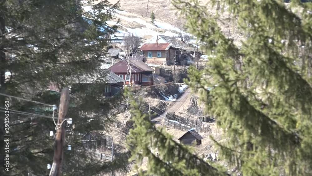 Sunny and warm spring day in the village. Snow melts, streams run, domestic animals splash in puddles, the river is freed from ice. Sunny and warm spring day in the village. Snow melts, streams run, domestic animals splash in puddles, the river is freed from ice.
