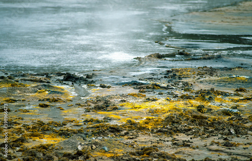 Hot spring with colored debris in Yellowstone National Park photo