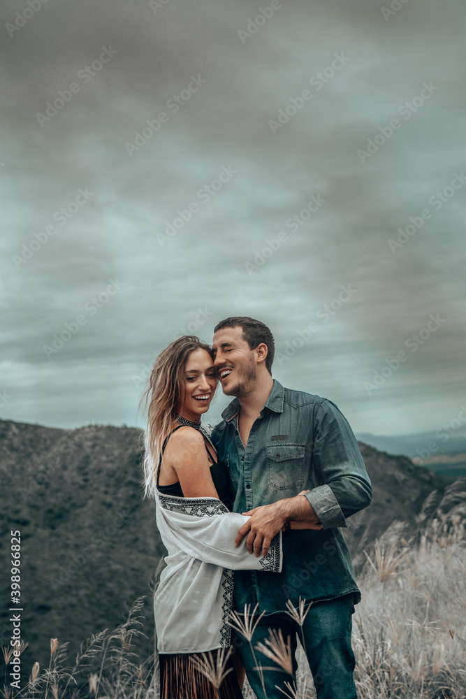 Fototapeta premium couple in love - husband and wife enjoying sunset 