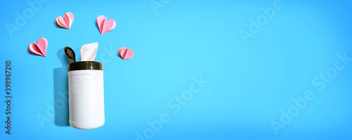 Sanitizer wipe with paper craft hearts - healthcare and hygiene concept