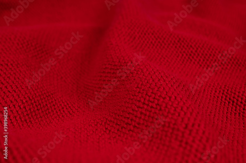 texture of knitted fabric in red with natural yoke