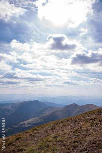 Impressive view from a Midzor mountain peak summit, the highest peak of Old mountain,2169 meters above sea level, and a view to surrounding peaks and highlands at summer Old Mountain in Serbia, Europe © Dragan