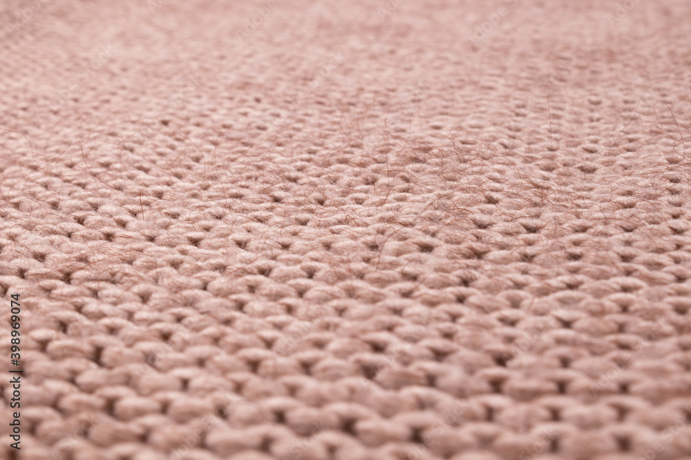 Perfectly flat and smooth surface of a beautiful beige woolen thread bedspread