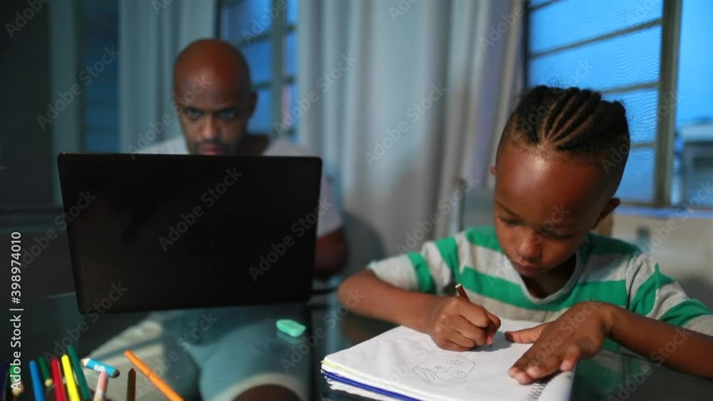 African american father working from home using laptop computer, black child son doing homework African american father working from home using laptop computer, black child son doing homework