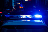 Policja - lampa sygnalizacyjno-ostrzegawcza, radiowóz policyjny, samochód policyjny