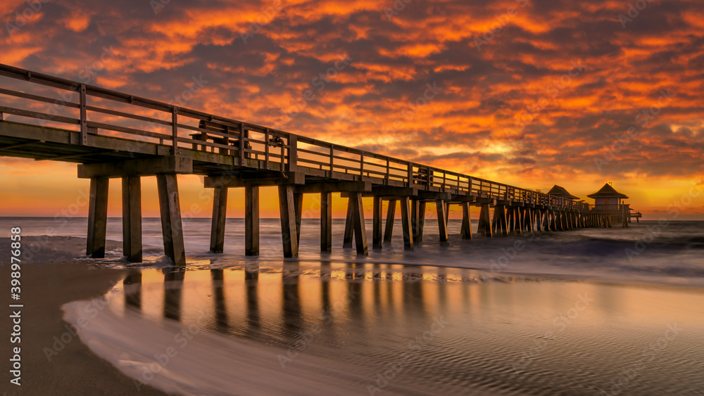 sunset on the pier. Coastal dream. Travel concept.